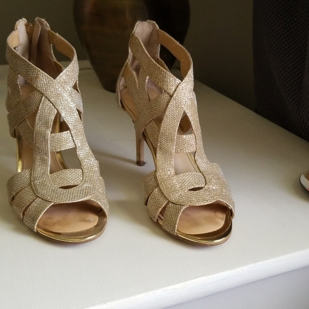 Gold  strappy high heels.